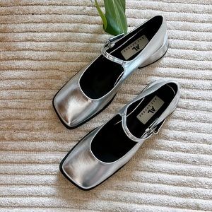 Brand new Mary janes in silver leather